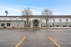 an empty parking lot in front of a building at Days Inn by Wyndham Imlay City in Imlay City