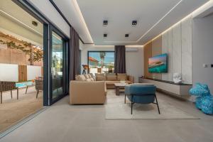 a living room with a couch and a table at Luxury Villa Elements - Novalja in Novalja