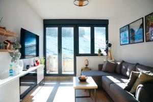 a living room with a couch and a table at Ravna Planina in Pale