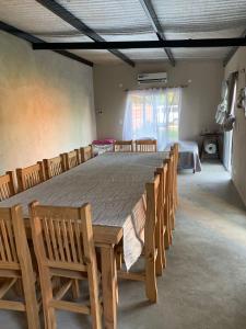 a large room with a large table and chairs at Las catalinas in General Rodríguez