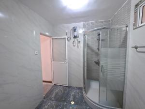 a bathroom with a shower and a walk in shower at The Duchess Hotel in Matara +14 photos