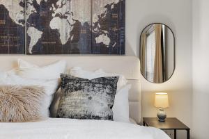a bedroom with a bed with a map on the wall at Spacious 2BR House, Steps from A&M - King - Patio in College Station