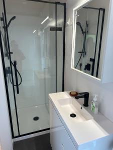 a bathroom with a sink and a shower at The Farm in Whangaruru +57 photos