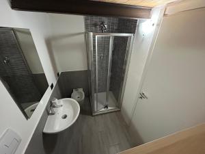 a bathroom with a sink and a shower at Casa Maria - next Milano,Como, Varese in Caronno Pertusella +3 photos