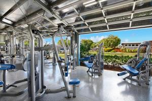 a gym with a lot of treadmills and chairs at Kiahuna Plantation Resort Kauai by OUTRIGGER in Koloa