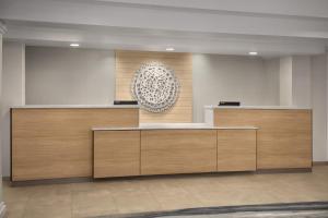 a lobby with wooden reception desks in a building at Fairfield Inn & Suites El Centro in El Centro