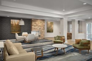 a lobby with chairs and tables at Fairfield Inn & Suites El Centro in El Centro
