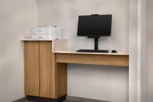 a desk with a computer monitor and a printer on it at Fairfield Inn & Suites El Centro in El Centro