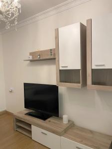 a living room with a flat screen tv on a wall at Apartamento Oyón in Logroño +22 photos