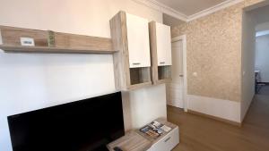a living room with a flat screen tv on a wall at Apartamento Oyón in Logroño