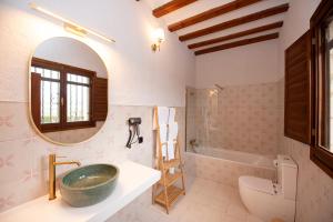 a bathroom with a sink and a mirror at Hotel Caseta Nova in Castalla +65 photos
