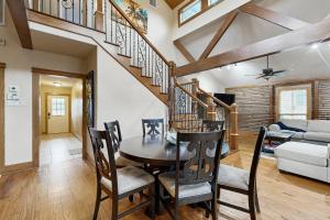 a dining room with a wooden table and chairs at Bacliff Family Getaway w/ Game Room + Private Pool in Bacliff