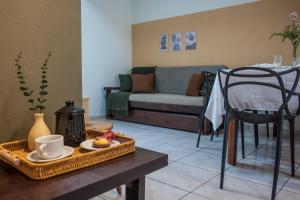 a living room with a table and a couch at Apartamento Brisa in Veranópolis