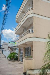 a building with a balcony on the side of it at Apartamento Brisa in Veranópolis