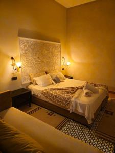 a bedroom with a large bed and a couch at bled ghazal in Marrakesh +71 photos