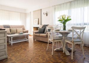 a living room with a table and a couch at Casa TINA in A Guarda
