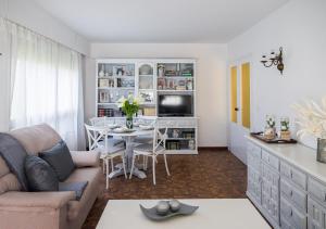 a living room with a couch and a table at Casa TINA in A Guarda