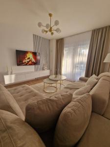 a large living room with a couch and a table at Yes Boss House Divcibare in Divčibare