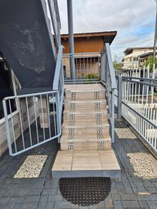 a set of stairs leading up to a slide at Donfarsha Apartments in Paramaribo +12 photos