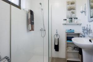 a bathroom with a shower and a sink at Casa TINA in A Guarda +29 photos