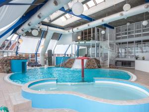 a large swimming pool on a cruise ship at 4 person holiday home on a holiday park in Hejls in Hejls +33 photos