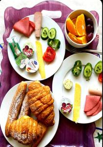 three white plates with different types of food on them at Sydney DownTown-Cairo in Cairo