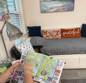 a person reading a map in a room at Suit with Kitchen & Bath in Cocoa