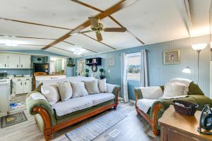 a living room with a couch and two chairs at Lakefront w/ Dock, Detached Studio, Fire Pit! in Georgetown +27 photos