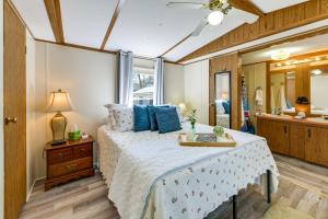 a bedroom with a bed and a large mirror at Lakefront w/ Dock, Detached Studio, Fire Pit! in Georgetown