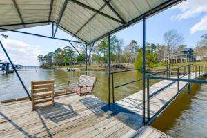 a dock with two benches on the water at Lakefront w/ Dock, Detached Studio, Fire Pit! in Georgetown