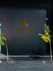 a sign on the side of a hotel lobby at Hotel Luxx in Sinop