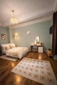 a bedroom with a bed and a desk in it at Halbinsel am See in Blieskastel