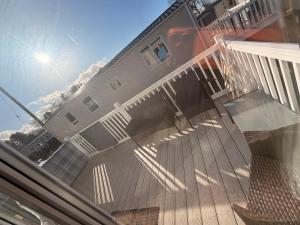 a front porch of a house with a deck at Hoopers Hideaway Caravan Rental SetonSands 2 in Port Seton