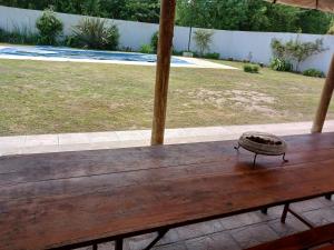 a wooden table with a bowl on top of it at Lodemabel in Bragado
