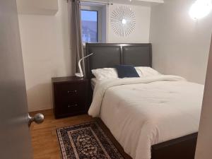 a bedroom with a bed and a window at Gull lake in Winnipeg