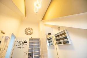 a shop with a clock on the wall and a window at DATRI Petite Suite 4 in Vienna