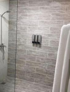a bathroom with a shower with a glass door at EL ricon del paseo in Mendoza