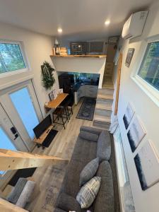 an aerial view of a living room and kitchen in a tiny house at Forest Nook in Queens Bay