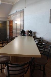 a large table in a room with chairs at Kaleva East in South Range