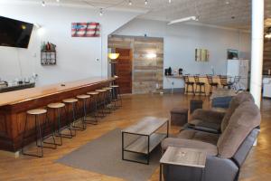 a bar in a room with chairs and a counter at Kaleva East in South Range
