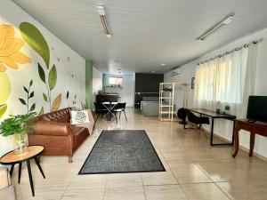 a living room with a couch and a table at Loft 967 in Itajaí