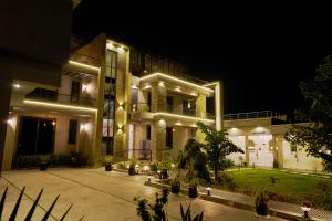 a large building with lights on it at night at The Lemiray Hotel in Dodoma