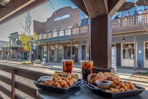 a table with a tray of bread and drinks on a street at Folsom Old Town Escape in Folsom