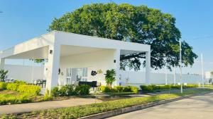 a white building on the side of a road at Casa de Sasha in El Matazano