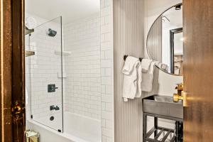 a bathroom with a sink and a shower at The Hideaway Big Bear in Big Bear Lake +106 photos