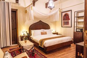 a bedroom with a large bed in a room at بوتيك خان عطره in Medina +15 photos