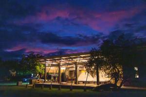 a building with a canopy at night with a sky at Panthera Lodge Yala in Kirinda +18 photos