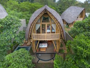an aerial view of a tree house in the forest at Mahajiva in Badung