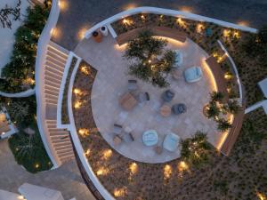 an overhead view of a patio at night with lights at Sandblu Santorini, LXR Hotels & Resorts in Kamari