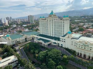 an aerial view of a large building in a city at The City Escape in Cebu City